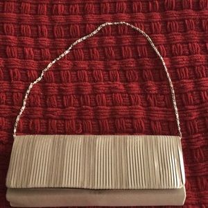 Button enclosure evening bag with chain strap